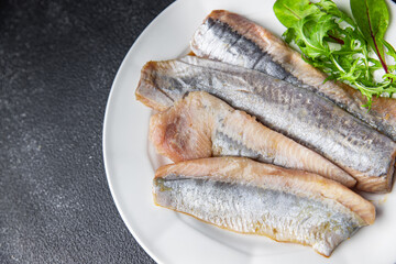 herring salted fish fillet fresh seafood healthy meal food snack on the table copy space food background rustic top view