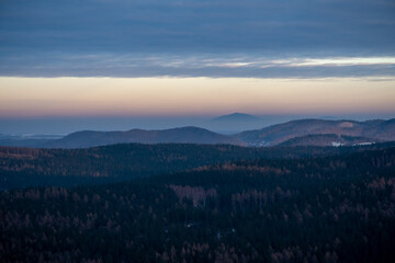 Panoramic view from the top of Dzikowiec Mountain, in Boguszow-Gorce near Walbrzych in Poland. Branches in foreground, selective focus. Popular viewing tower.
