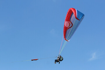 Tandem Paraglider being towed by a winch	