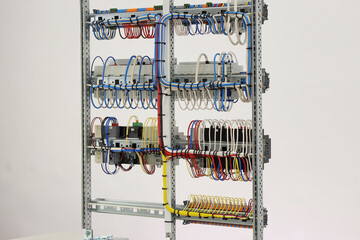 The reverse side of the electrical switchboard, the mounting wires that connect the modules, tightened with plastic ties