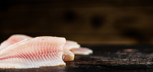 Fresh raw fish fillet on the table. 