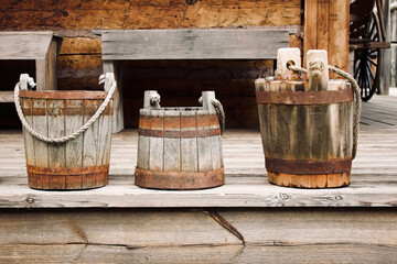 Vintage buckets on a porch © Heidi