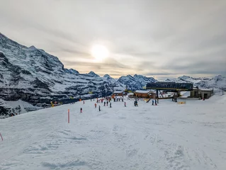Fotobehang Ski slopes and mountains in Jungfrau ski resort in Swiss Alps, Grindelwald, Switzerland © Martin Valigursky