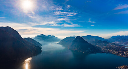 Fototapeta na wymiar Lugano, Switzerland. Amazing view of the Swiss city, surrounded by lake and mountains.