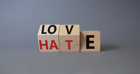 Love vs Hate symbol. Wooden cubes with words Hate and Love. Beautiful grey background. Valentines Day and Love vs Hate concept. Copy space