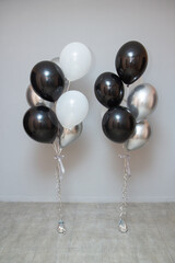 set of black and silver birthday balloons