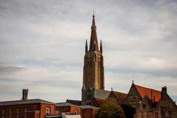 Obraz premium Gothic architecture in Flanders. Cathedral tower in Bruges, Belgium.