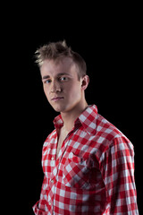 Serious boy looking at camera and looking at camera