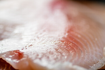 Raw fish fillet. Macro background. Texture of fish fillet.