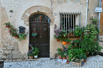 Fototapeta na wymiar The door of an old house of Priverno, an old village in Lazio, not far from Rome, Italy.