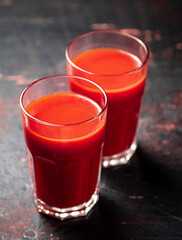 Juice from ripe tomatoes in a glass. 