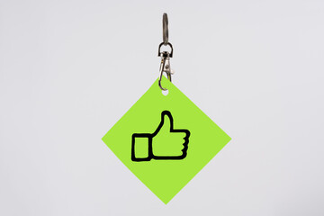 positive thumbs up key fob mock up template isolated on a white background