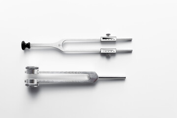 tuning fork C 128 on a white background with gradation
