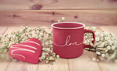 Valentine's day concept. A pink cup of coffee with the inscription 