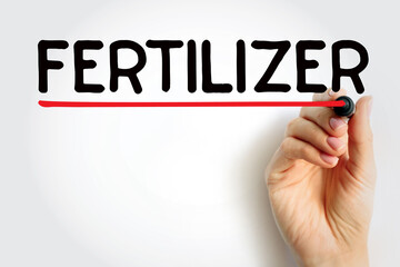 Fertilizer - any material of natural or synthetic origin that is applied to soil or to plant tissues to supply plant nutrients, text concept background