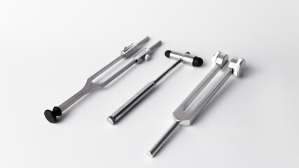 tuning fork C 128 on a white background with gradation and neurological hammer