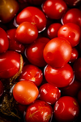 Pickled tomatoes in brine. Macro background.