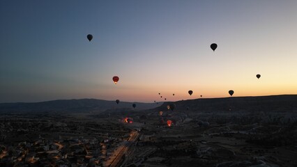 Incredible sunrise and balloons over the hills in Cappadocia. The view from the drone.