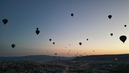 Incredible sunrise and balloons over the hills in Cappadocia. The view from the drone.