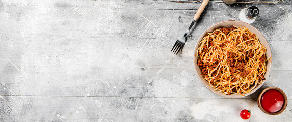 Homemade spaghetti bolognese. On a gray background.