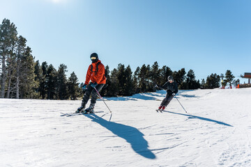 Two boys skiing on the mountain