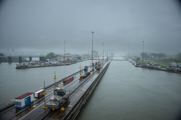 Rain at the Miraflores locks on the Panama canal,  foggy day