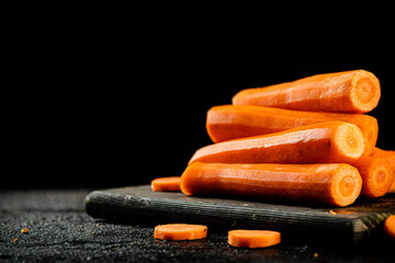 Fresh carrots on a cutting board. 