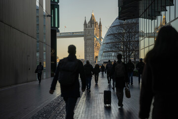 Commuters walking to work near Tower Bridge in London