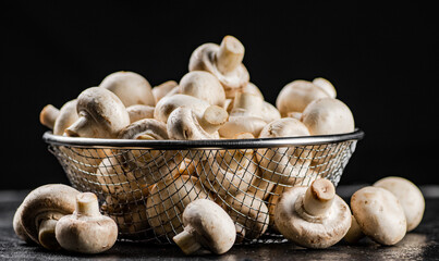 Fresh mushrooms in a colander. 