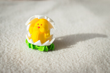 Easter chicken candy on white background. Easter decoration. Springtime holidays. Decorative sweets. Easter chicken in egg. Sugar handmade dessert. Happy Easter symbol. 