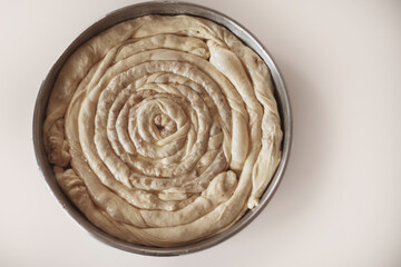 Turkish Tepsi Boregi, Round Borek, Tray pastry (Turkish name; rulo borek) uncooked