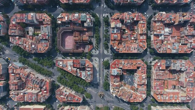 Aerial view of Barcelona Eixample residential district and old town narrow streets, gothic quarter at sunrise. Catalonia, Spain
