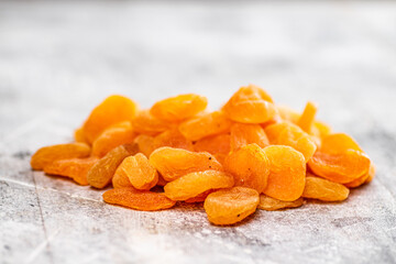 A pile of delicious dried apricots on the table. 