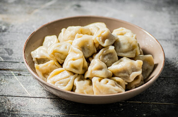 Boiled homemade dumplings on a plate. 
