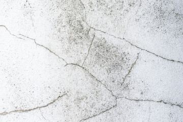 Background of white wall with cracks, texture, wall, concrete, can be used as a background. Fragment of a wall with scratches and cracks