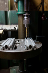 Part machining with drilling machine
