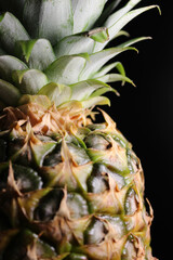 Top of a pineapple fruit with a rosette of leaves stock photo