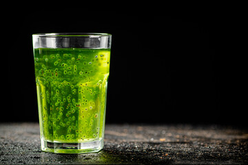 A glass of fresh kiwi juice. 