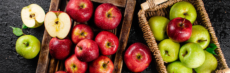 An assortment of red and green apples on the table. 