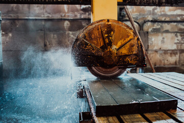 A stone cutter processes stone and granite slabs in the industry