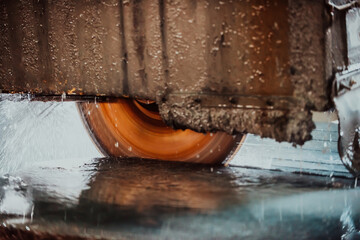 A stone cutter processes stone and granite slabs in the industry