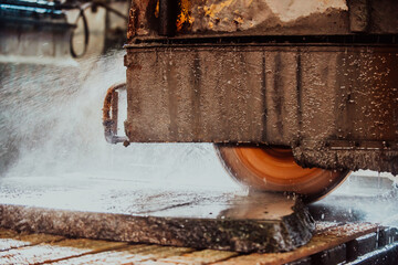 A stone cutter processes stone and granite slabs in the industry