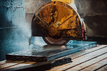 A stone cutter processes stone and granite slabs in the industry