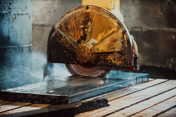 A stone cutter processes stone and granite slabs in the industry