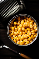 An open can of canned corn. 