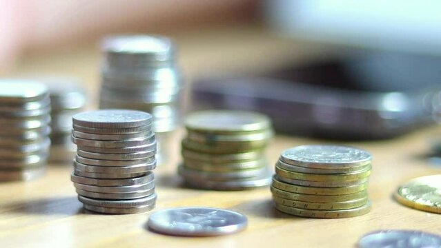 Coins on hand, coins on table, bitcoin, dirhams, euro coins
