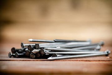 A pile of nails on the table. 