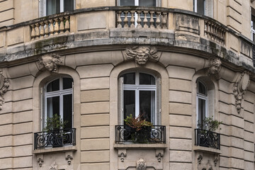 Traditional old French house: balconies and windows. Paris, France.