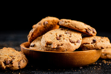 Homemade cookies with chocolate. Against a dark background