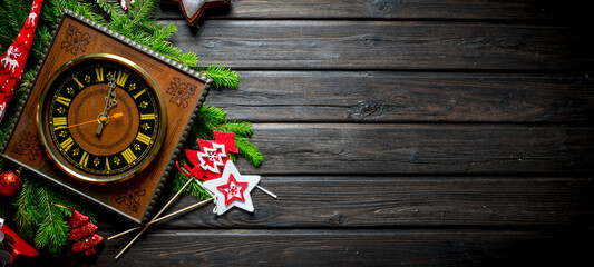 Christmas composition of old clocks, ornaments and fir branches.